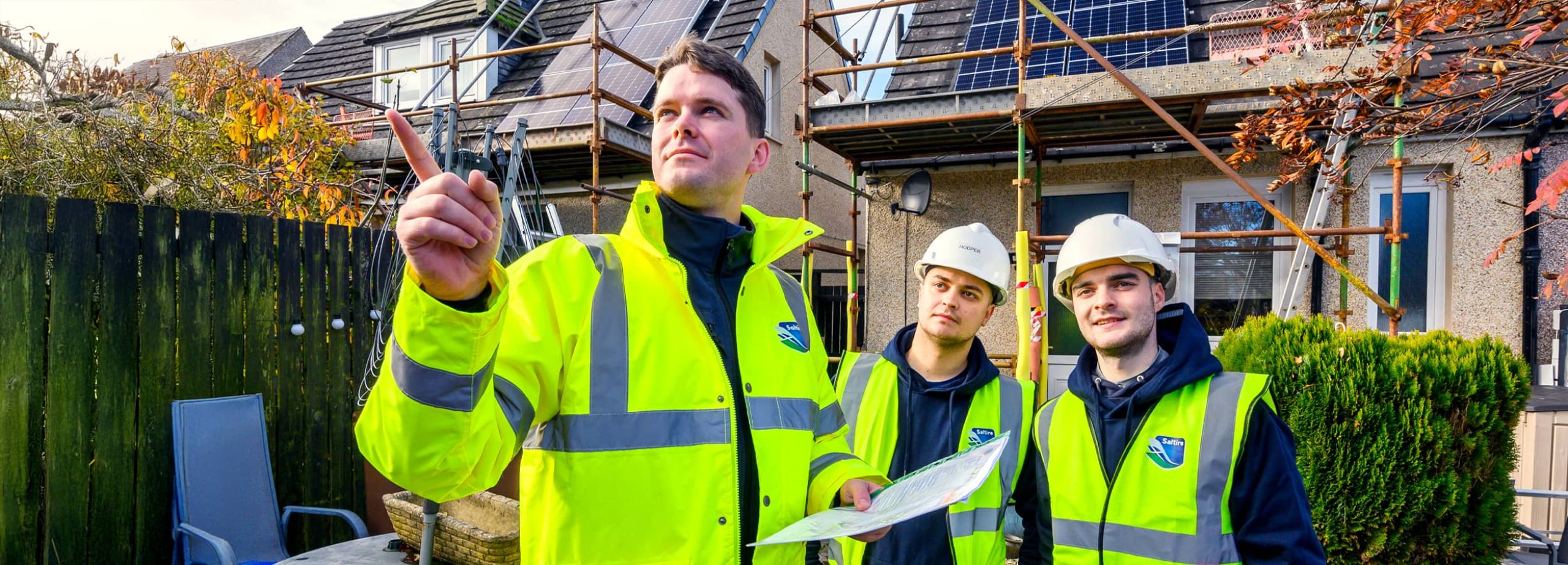 saltire workers and solar panels on house